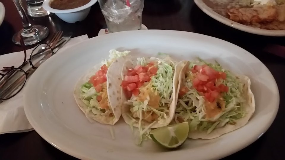Restaurant menu listing Mexican favorites and breakfast items.