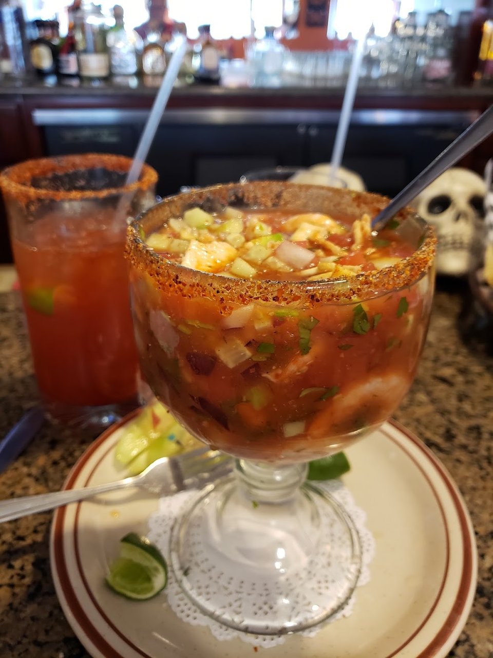 Printed menu with burritos, soups, and seafood plates.