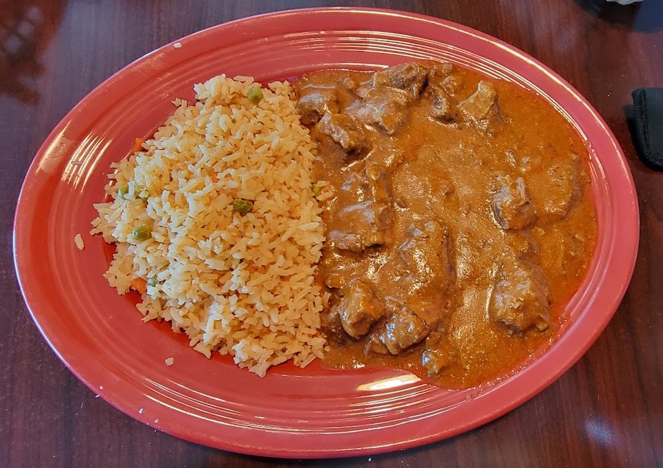 Restaurant menu listing Mexican favorites and breakfast items.