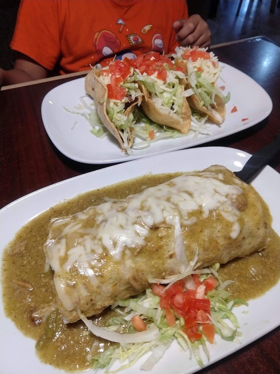 Restaurant menu listing Mexican favorites and breakfast items.