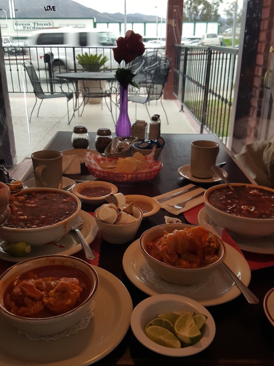 Printed menu with burritos, soups, and seafood plates.